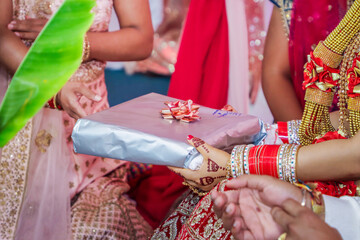 Fototapeta na wymiar Indian Hindu wedding ceremony and pooja ritual items, hands, and decorations close ups