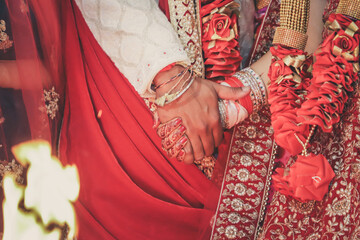 Indian Hindu wedding ceremony and pooja ritual items, hands, and decorations close ups