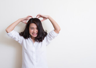 Portrait of young asian woman standing and smiling