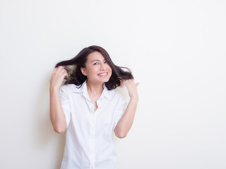 Portrait of young asian woman standing and smiling