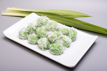 A set of traditional confectionery famous in Malaysia,Indonesia and Singapore,know as Buah Melaka or ondeh-ondeh ,isolated over grey,food photography concept 
