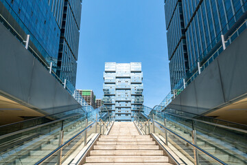 Escalator and office building appearance in financial center, Chongqing, China