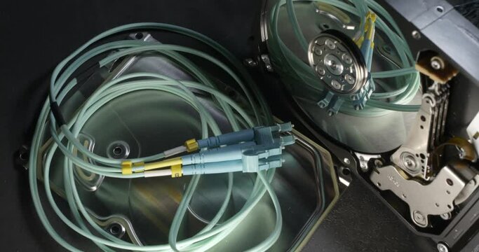 Open Hard Drive enclosure and Fiber cable, Light moving around, creating shadows