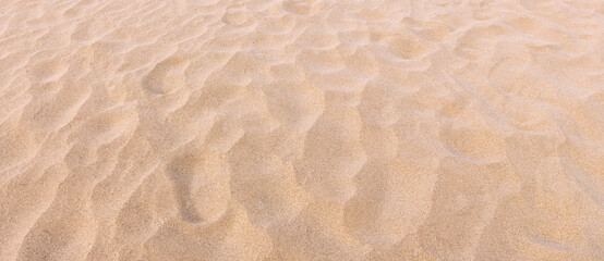 Fototapeta na wymiar footmarks on sand and sand texture and background