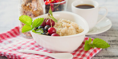 porridge with berries on a table, selective focus