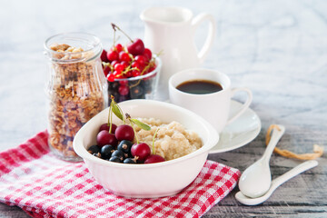 porridge with berries on a table, selective focus