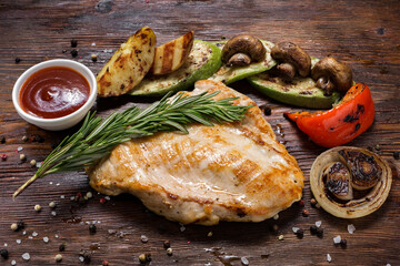 steak with vegetables lies on a wooden table