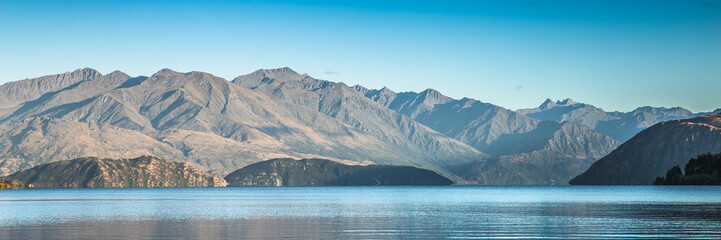 Mountain lake landscape lake wanaka New Zealand. Popular travel destination for tourism in south island new zealand. banner background. blue sky.
