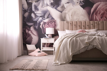 Stylish floral room interior with comfortable bed