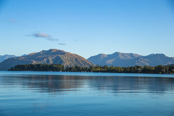 Lake Wanaka New Zealand Landscape. Mountains and lake landscape scenic view. Popular travel destination in South Island NZ.