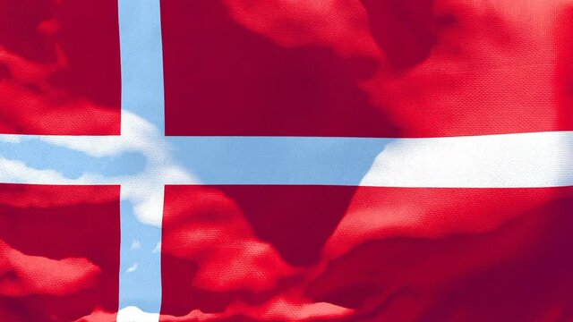 The national flag of Denmark is flying in the wind