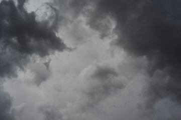Dark clouds background. The sky is covered all over by clouds before rainfall.