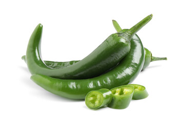 Cut and whole green hot chili peppers on white background