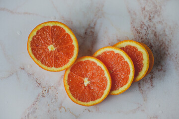 sliced orange on marble background