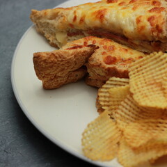 Close up of quesadilla bread and chips on a white plate. Food Fotography