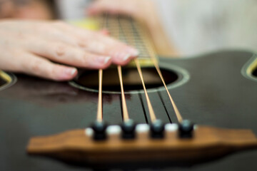Fototapeta premium Woman holding an acoustic bass guitar