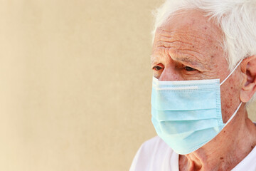 portrait of senior man using healthcare face mask, protect Covid-19