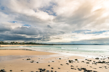 coastline beach sand sea rock sunset