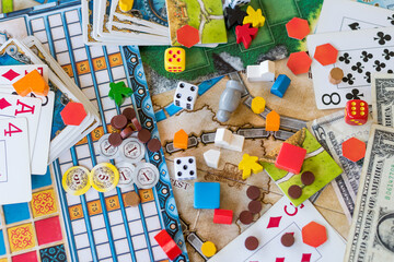 Board games, coins, bills, dice and cards
