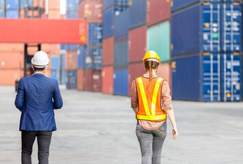 Engineer team checking containers box with social distancing from cargo, Logistic and teamwork concept