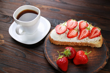 Strawberry bruschetta with cottage cheese. Homemade healthy toast, delicious snack for kids. Fruit sweet sandwich with ripe summer berries