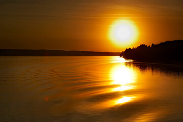 Fototapeta premium Sunset orange lake water reflection landscape. Reflection of sunset water. River sunset orange view. Sunset river water reflection
