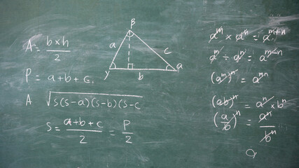 The class board is written with mathematical equation formulas.