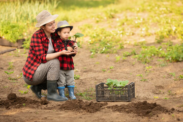 woman gardener with son