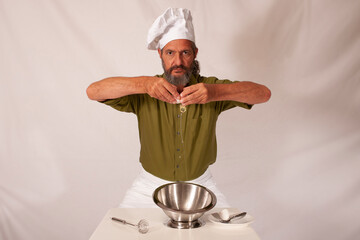 funny chef acting with vegetables