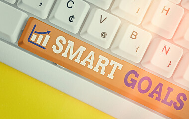 Conceptual hand writing showing Smart Goals. Concept meaning mnemonic used as a basis for setting...