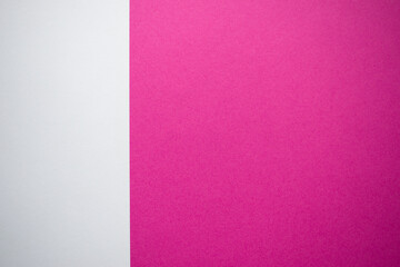 Pink and white vertically divided background with copy space
