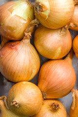Full Frame vertical Shot Of yellow Onions. Close-up.