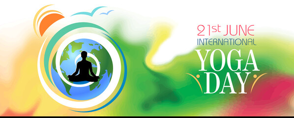 A silhouette of a person meditating on the international yoga day. Earth and the rising sun with colorful background