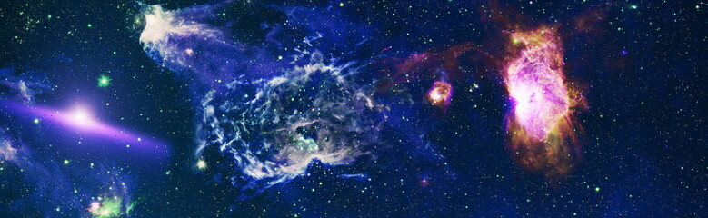 Beautiful night sky with colorful nebulae and galaxies. Abstract image. Elements of this image...
