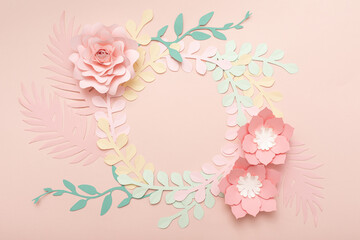 Flat lay of paper flowers on pastel pink background. Summer fashion and trendy frame