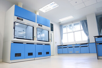 Laboratory fume hoods in science classroom interior of university college for protect the user from inhaling toxic gases (fume hoods, biosafety cabinets, glove boxes). - obrazy, fototapety, plakaty