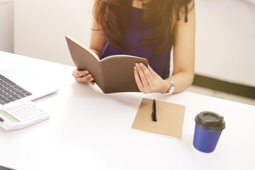 Online studying class for E learning. Smart student girl sitting at table watching lesson online and studying from home. Stay home stay safe