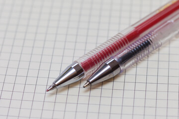 Two gel pens on paper