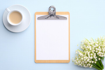 Wedding checklist concept. Flat lay paper clipboard mockup with cup of coffee and bouquet of...