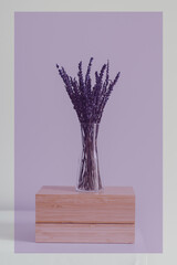 Purple toned image of dried lavender and wooden jewelry box. Minimal style. Purple color