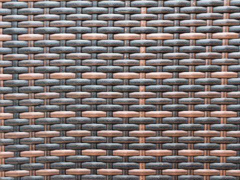 Plastic weaving texture. Surface of interlaced nylon strings. Brown plastic weave for furniture material.