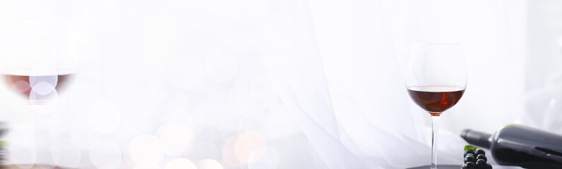 Glass with grape red semi-dry wine. Valentine's day concept background. Gift for the holiday. Sweet sparkling wine.