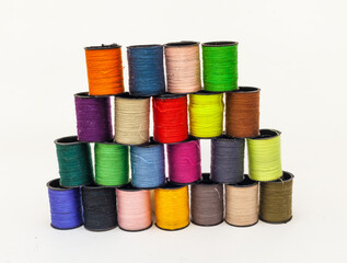 Coil set with colored thread on a white background