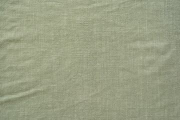 Top view of textile fabric of khaki color as background