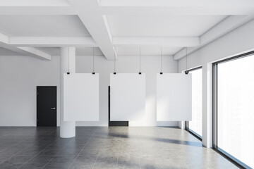 Empty white gallery interior, posters and doors
