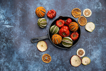 Flat lay top down image of dried seasonal Winter fruit on textured rough background