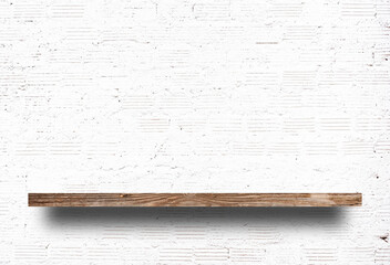 Brown wood shelf on a white brick wall background.