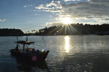motorboat at the coast of thailand in evening sun - 355818904