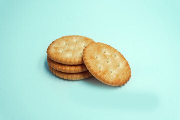 Circle cracker cookies on light blue background