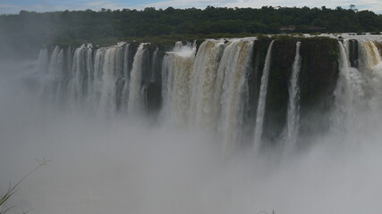 Views of the spectacular Iguazu waterfall on a sunny day i from many points of view